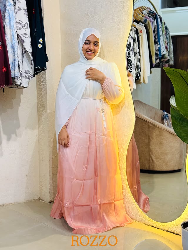 Model wearing a pink Rozzo organza gown